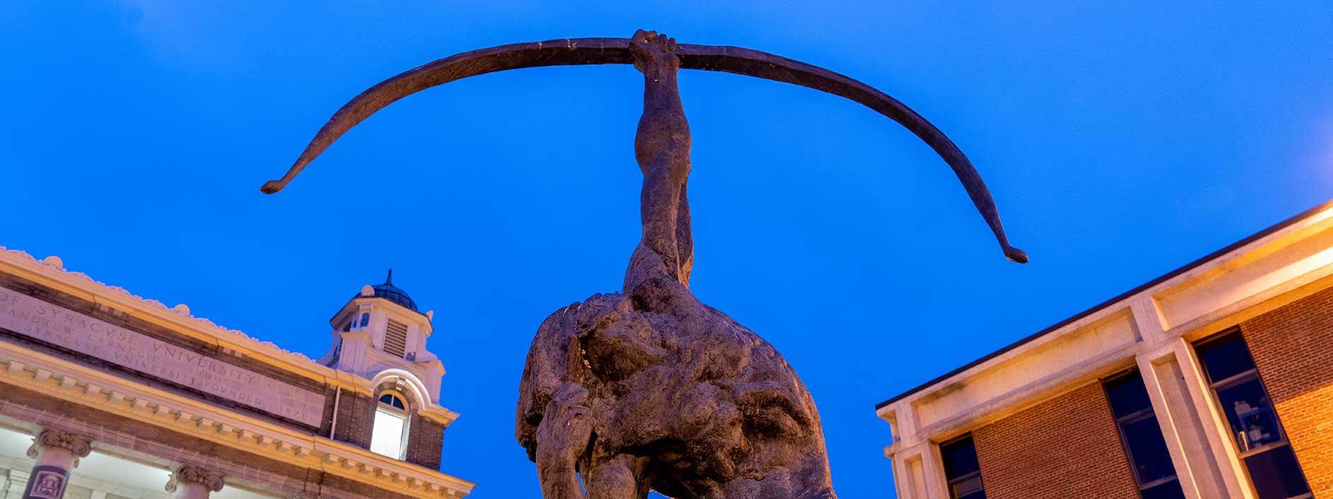 campus statue at night