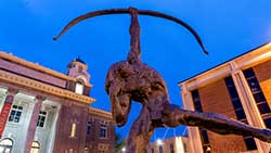 campus statue at night